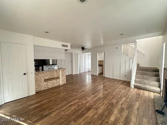 a view of a livingroom with wooden floor