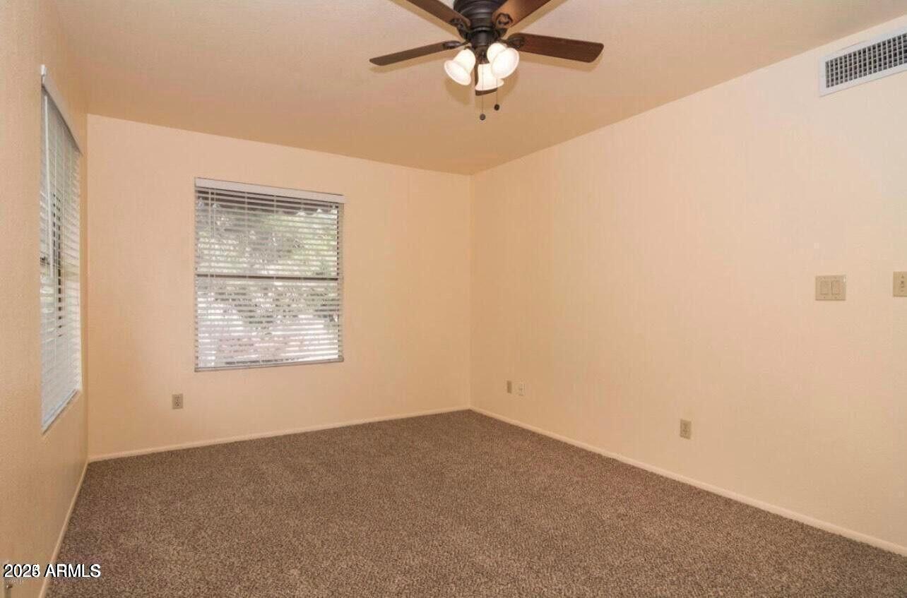 16225 North 30th Street, Unit 9 Phoenix, AZ 85032 - Photo 9 of 19 an empty room with a window