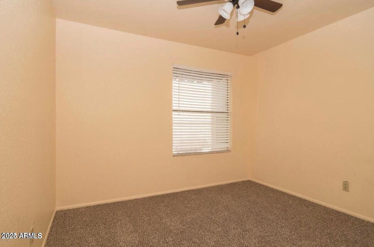 16225 North 30th Street, Unit 9 Phoenix, AZ 85032 - Photo 10 of 19 a view of an empty room with a window
