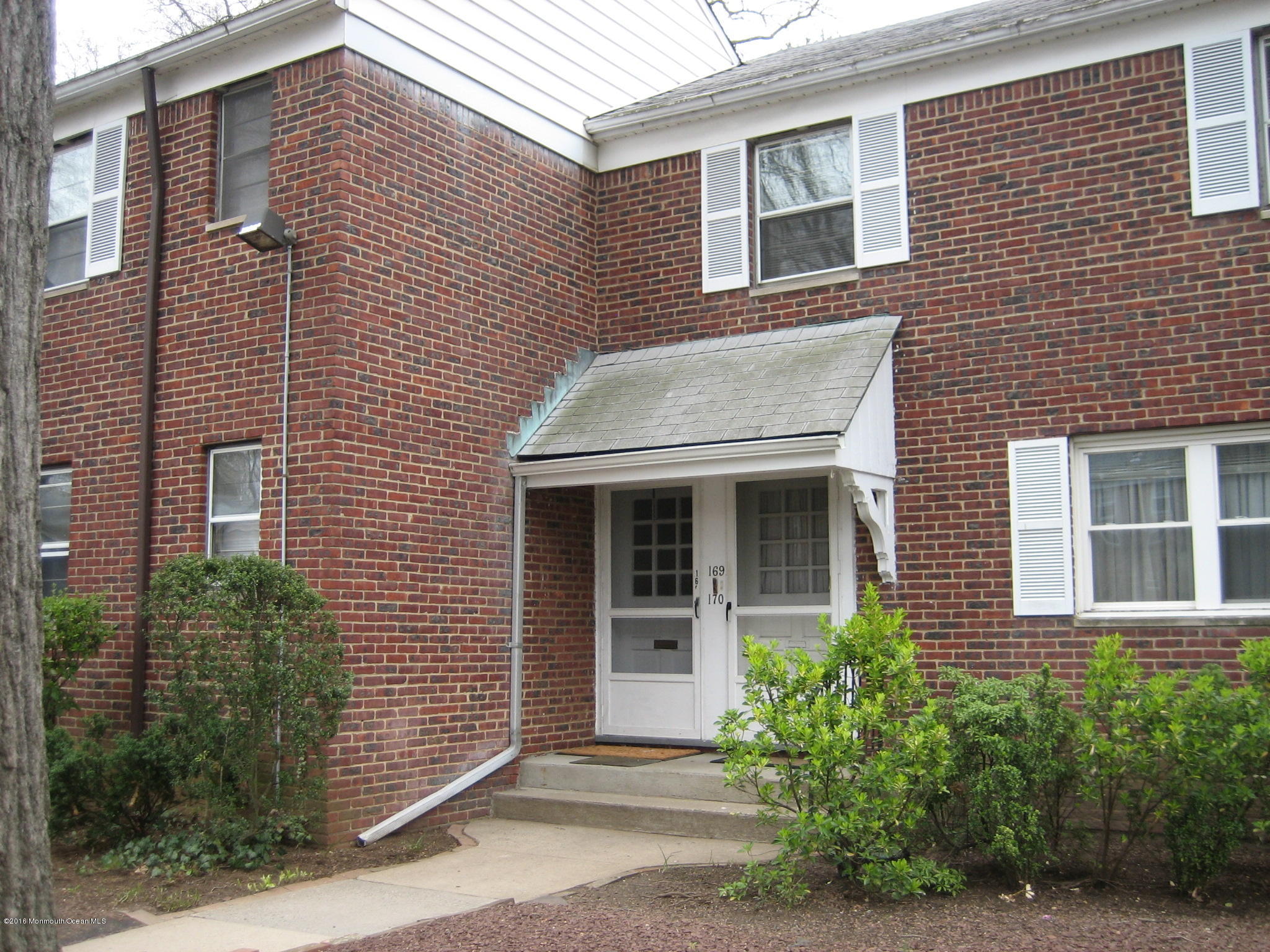 a brick house with a large windows