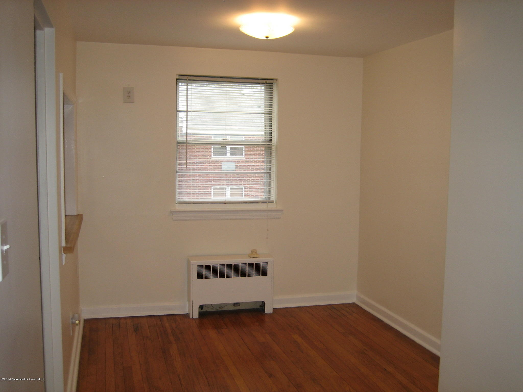 169 Manor Drive Red Bank, NJ 07701 - Photo 7 of 12 an empty room with a window
