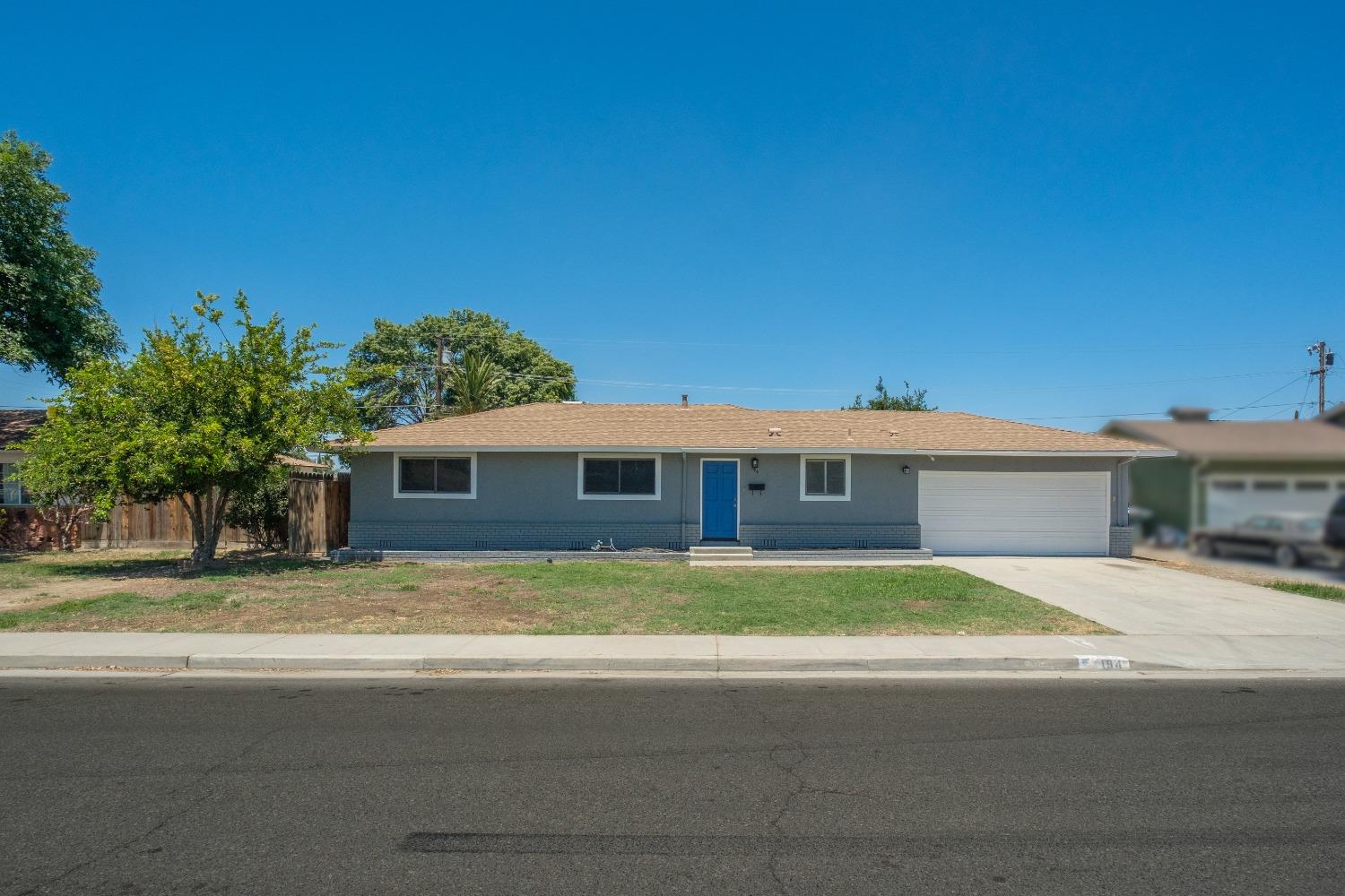 194 West Spring Lane Lemoore, CA 93245 - Photo 1 of 15 a view of house with outdoor space and street view