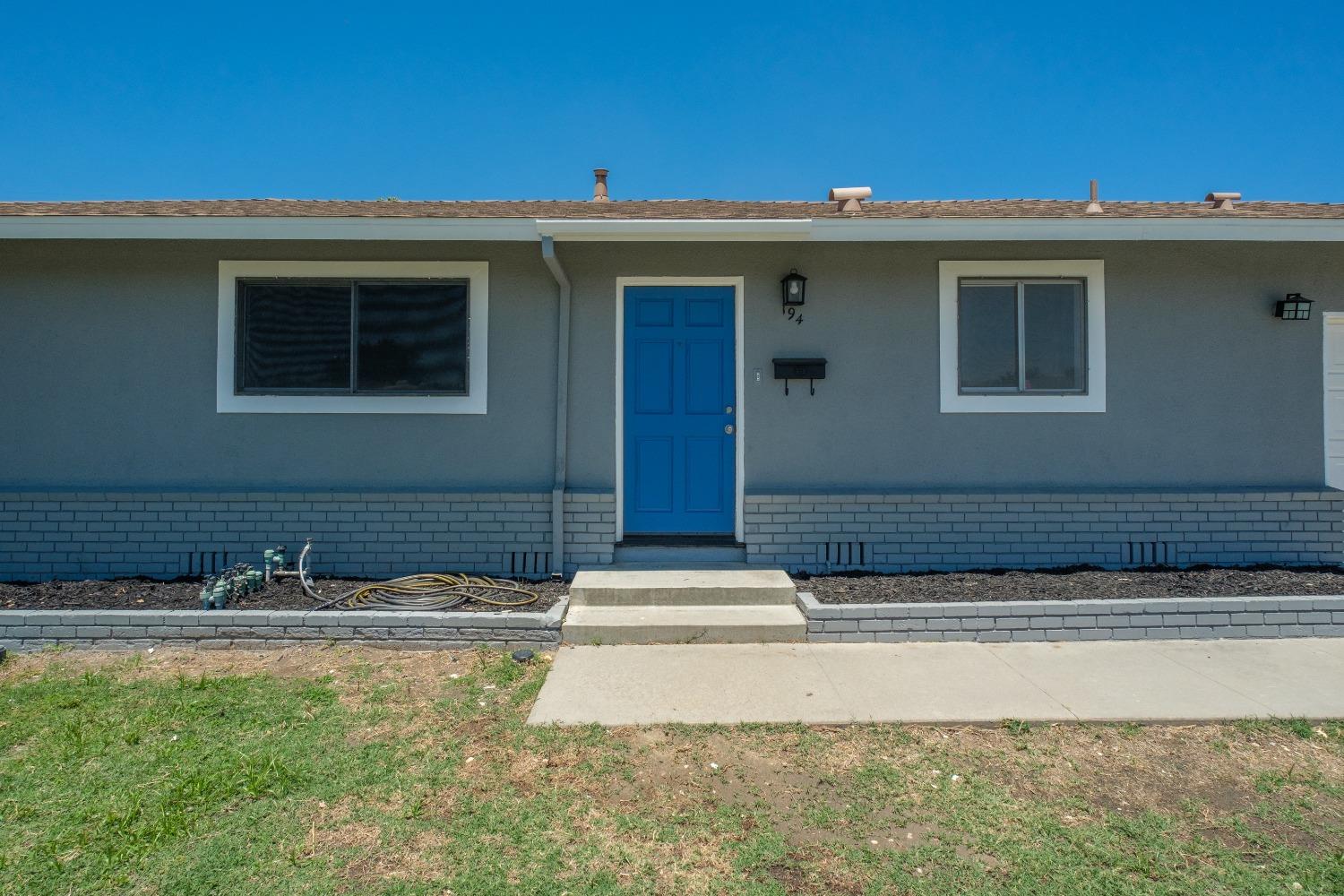 194 West Spring Lane Lemoore, CA 93245 - Photo 3 of 15 a front view of a house