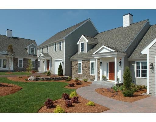 30 Caldwell Farm Road, Unit 30 Newbury, MA 01951 - Photo 1 of 1 a front view of a house with a yard table and chairs