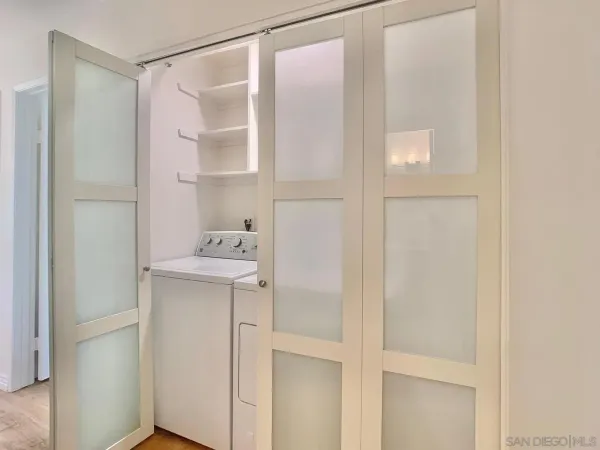 a bathroom with a shower and a sink