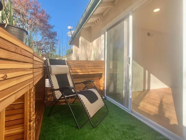 a view of balcony with furniture