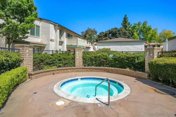 a view of a swimming pool with a patio