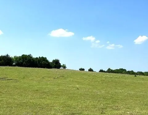 a view of a lake with houses in the back