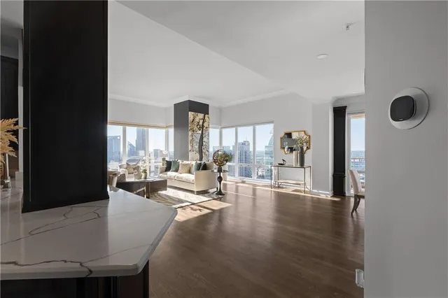 a view of a room with furniture window and wooden floor