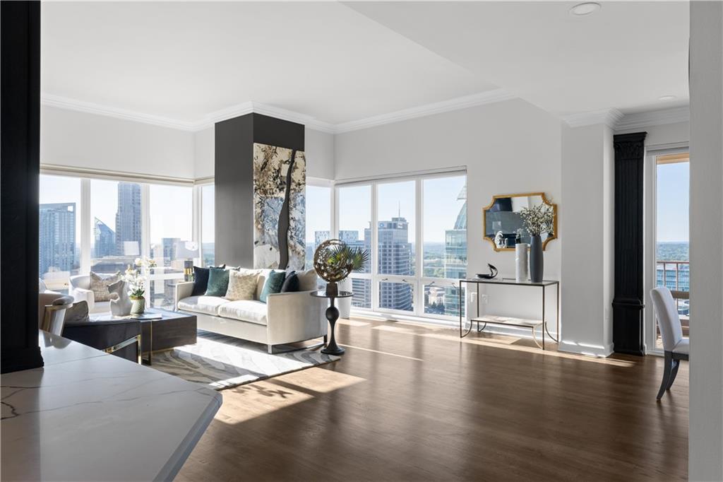 3475 Oak Valley Road Northeast, Unit 2820 Atlanta, GA 30326 - Photo 13 of 86 a living room with furniture large window and wooden floor