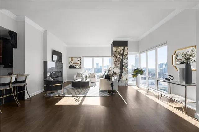 a view of a livingroom with furniture and a window