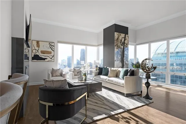 a bedroom with a bed and large window