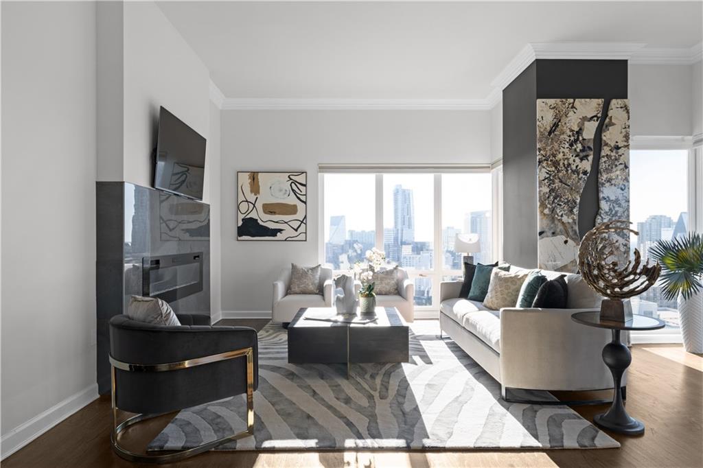 3475 Oak Valley Road Northeast, Unit 2820 Atlanta, GA 30326 - Photo 18 of 86 a living room with furniture and a fireplace