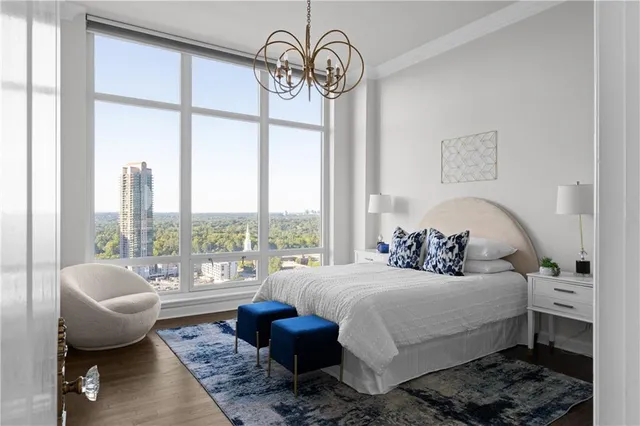 a living room with furniture windows and a chandelier