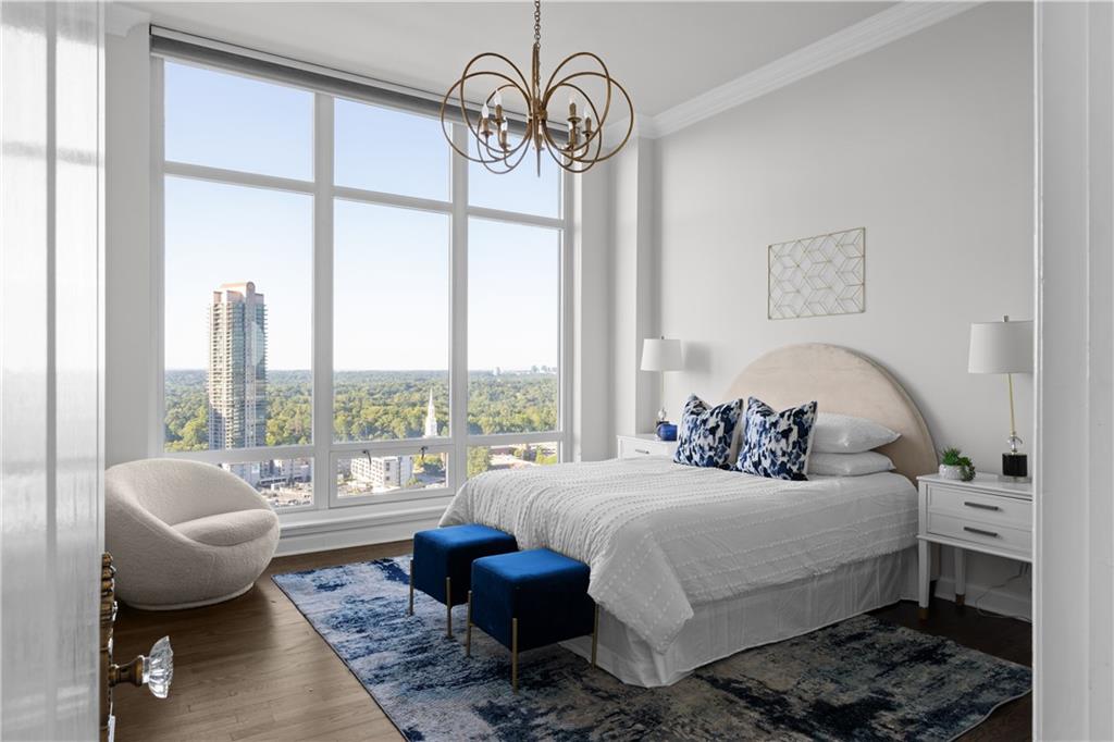 3475 Oak Valley Road Northeast, Unit 2820 Atlanta, GA 30326 - Photo 25 of 86 a bedroom with a bed and a large window