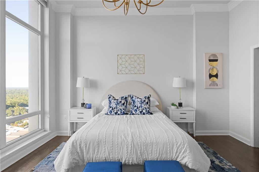 3475 Oak Valley Road Northeast, Unit 2820 Atlanta, GA 30326 - Photo 26 of 86 a bedroom with a bed and a window