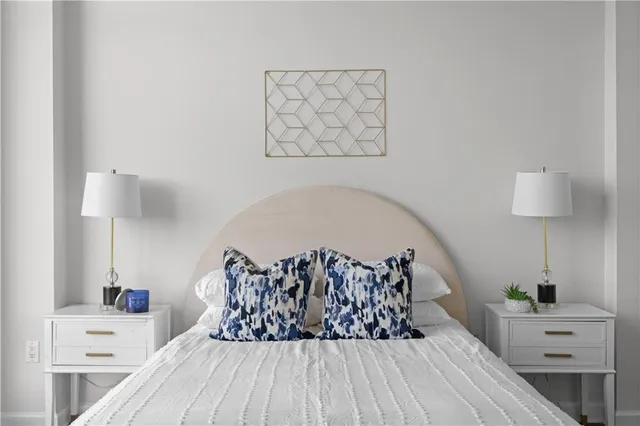 a bed room with a bed and a chandelier