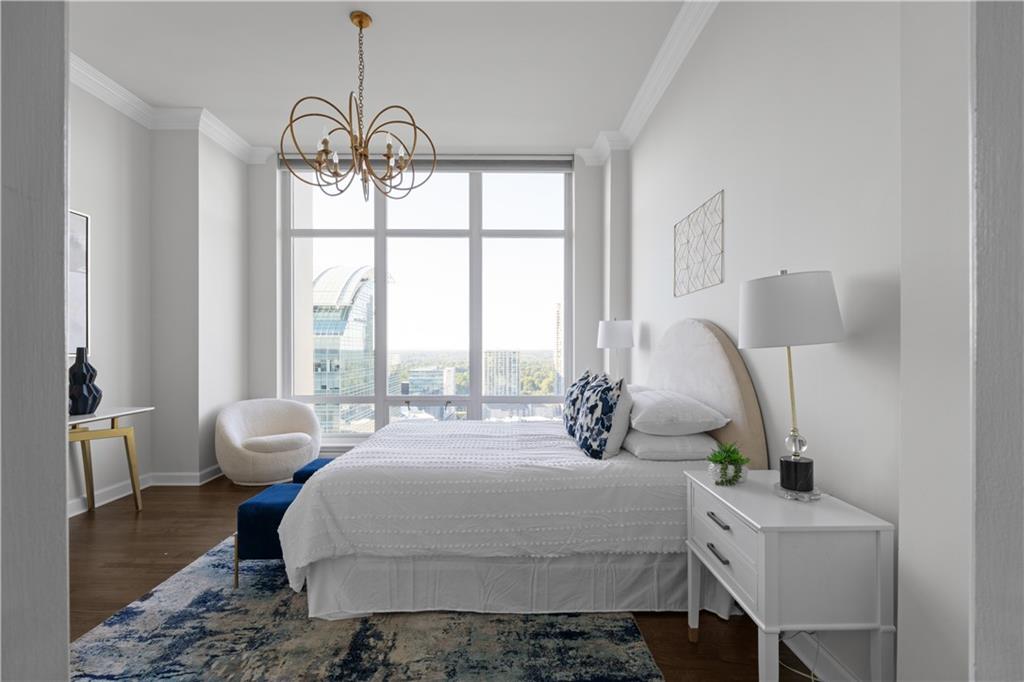 3475 Oak Valley Road Northeast, Unit 2820 Atlanta, GA 30326 - Photo 28 of 86 a bedroom with a bed and large window