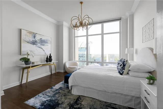 a bathroom with a granite countertop sink a mirror and a shower