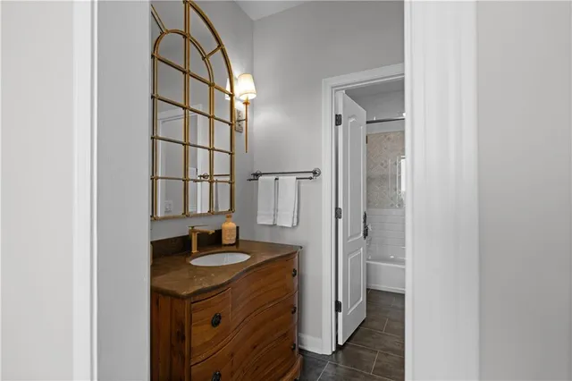 a bathroom with a shower and a sink