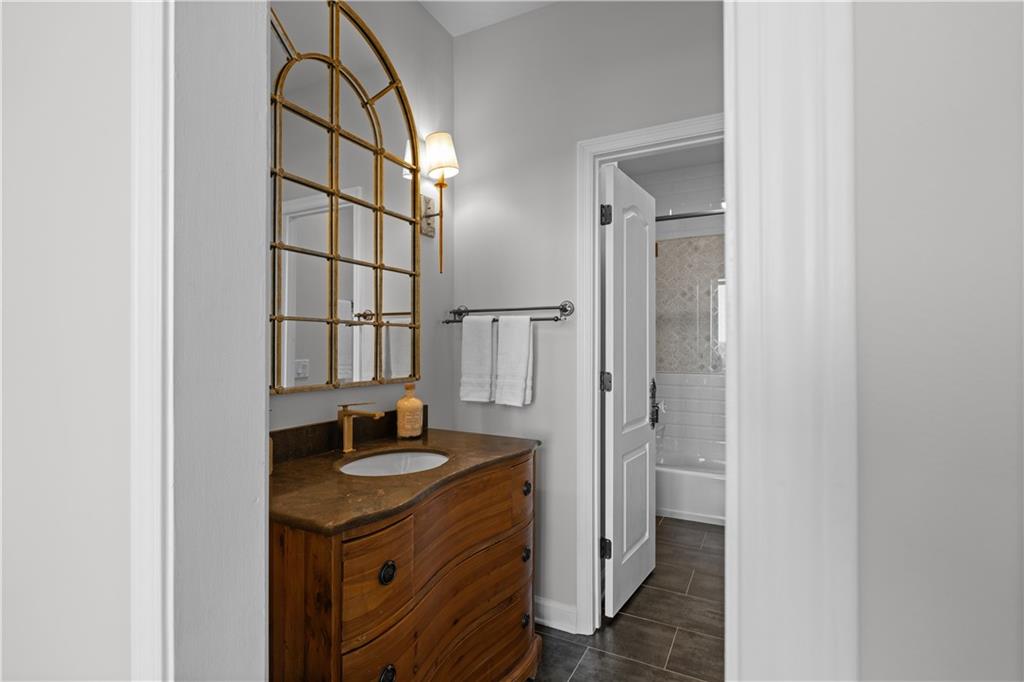 3475 Oak Valley Road Northeast, Unit 2820 Atlanta, GA 30326 - Photo 30 of 86 a bathroom with a sink and a mirror