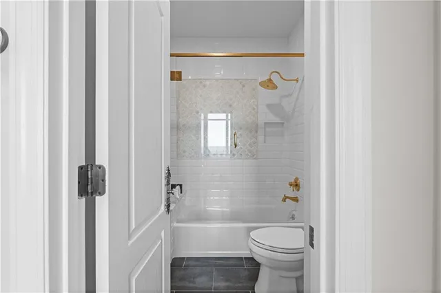 a view of a room with window and wooden floor