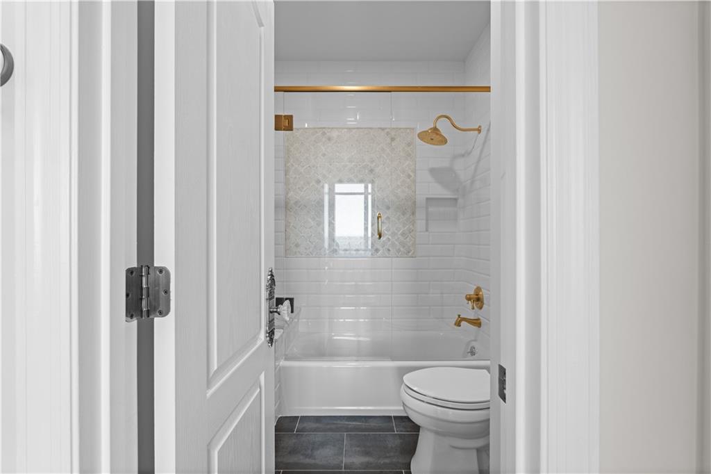 3475 Oak Valley Road Northeast, Unit 2820 Atlanta, GA 30326 - Photo 31 of 86 a bathroom with a toilet and a shower