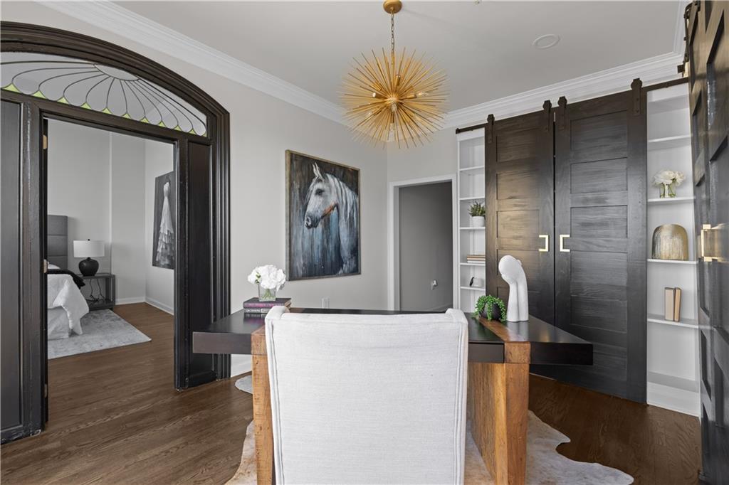 3475 Oak Valley Road Northeast, Unit 2820 Atlanta, GA 30326 - Photo 36 of 86 a kitchen with a refrigerator and a wooden floor