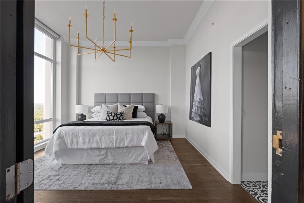 3475 Oak Valley Road Northeast, Unit 2820 Atlanta, GA 30326 - Photo 38 of 86 a living room with a bed furniture and a window