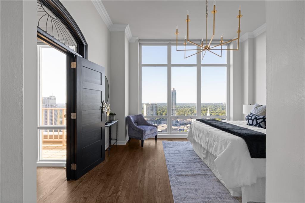 3475 Oak Valley Road Northeast, Unit 2820 Atlanta, GA 30326 - Photo 39 of 86 a living room with furniture windows and a chandelier