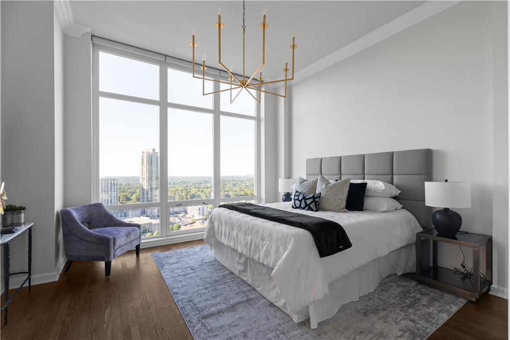 3475 Oak Valley Road Northeast, Unit 2820 Atlanta, GA 30326 - Photo 40 of 86 a bedroom with a bed and a large window