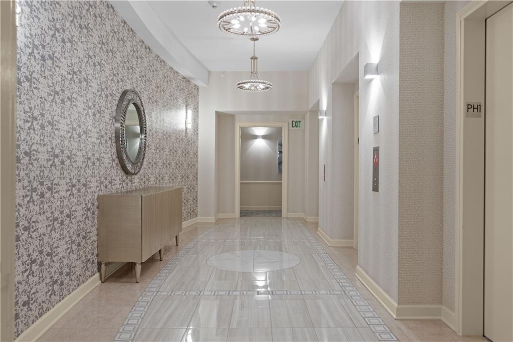 3475 Oak Valley Road Northeast, Unit 2820 Atlanta, GA 30326 - Photo 4 of 86 a view of a bathroom with a sink and a mirror
