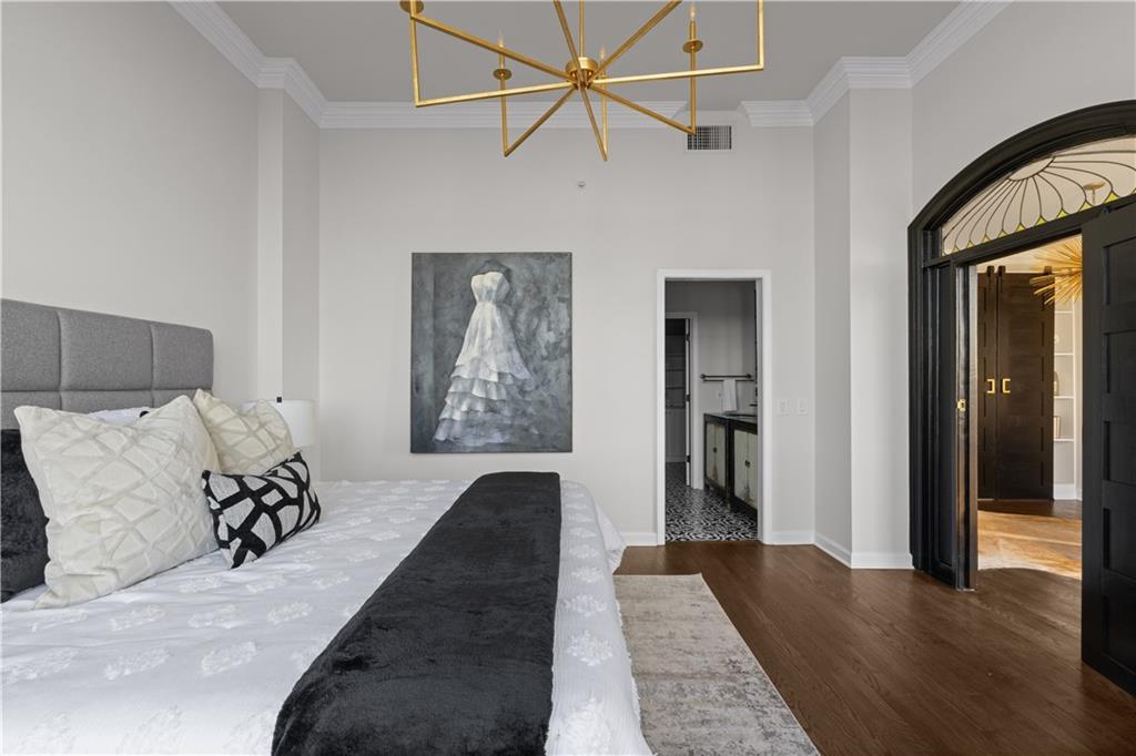 3475 Oak Valley Road Northeast, Unit 2820 Atlanta, GA 30326 - Photo 41 of 86 a bed room with a bed and a chandelier