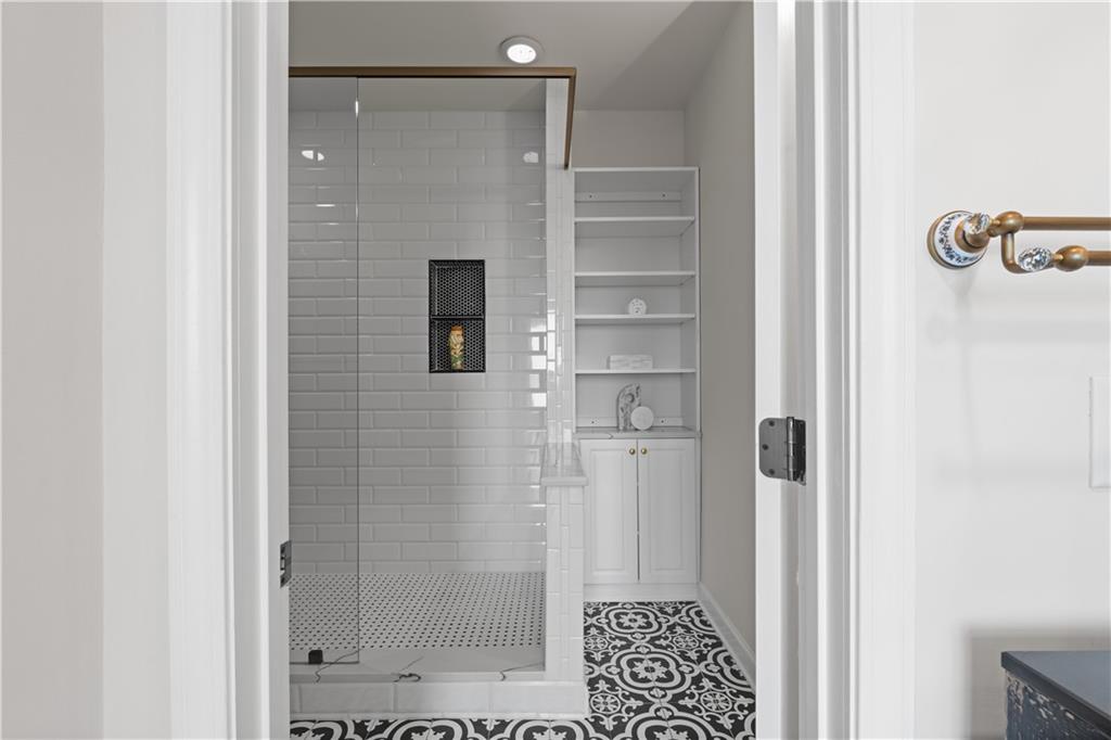 3475 Oak Valley Road Northeast, Unit 2820 Atlanta, GA 30326 - Photo 44 of 86 a bathroom with a shower and a sink