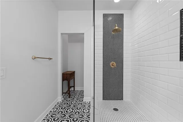 a kitchen with stainless steel appliances granite countertop a stove and a refrigerator