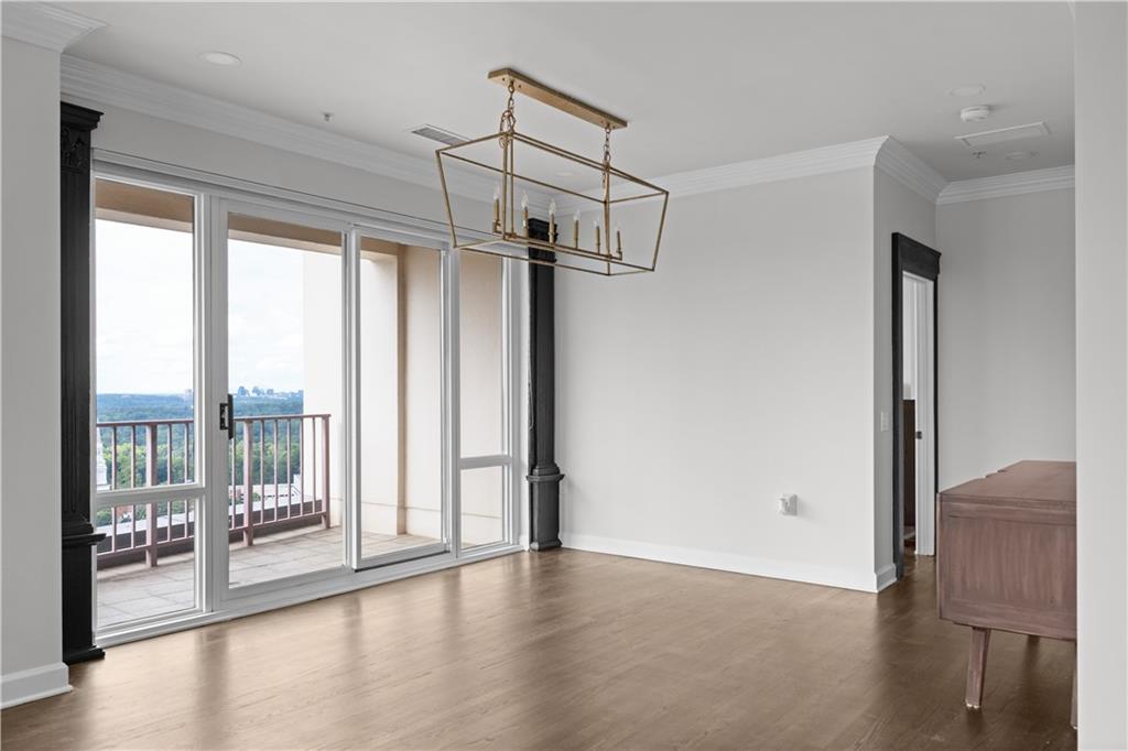 3475 Oak Valley Road Northeast, Unit 2820 Atlanta, GA 30326 - Photo 49 of 86 a view of a room with window and wooden floor