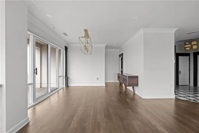 a view of two chairs and tables in the patio