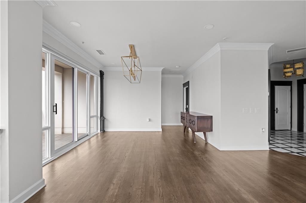 3475 Oak Valley Road Northeast, Unit 2820 Atlanta, GA 30326 - Photo 50 of 86 a view of empty room with wooden floor and fan