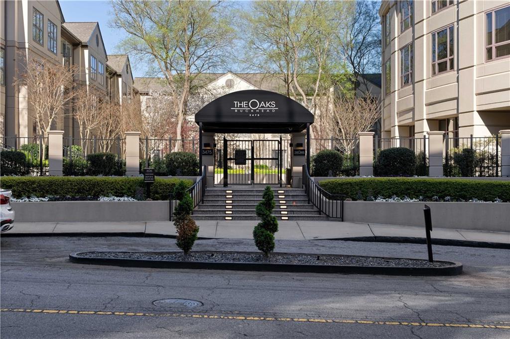 3475 Oak Valley Road Northeast, Unit 2820 Atlanta, GA 30326 - Photo 60 of 86 a front view of a building with garden