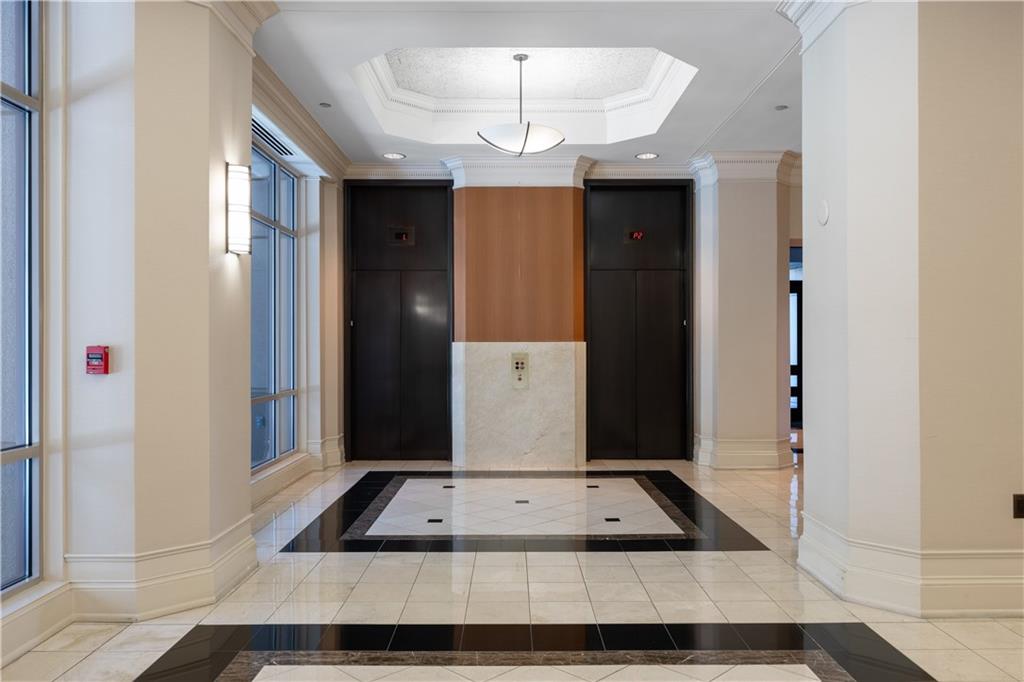 3475 Oak Valley Road Northeast, Unit 2820 Atlanta, GA 30326 - Photo 63 of 86 a front view of a house with a porch