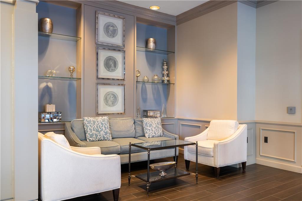 3475 Oak Valley Road Northeast, Unit 2820 Atlanta, GA 30326 - Photo 65 of 86 a living room with furniture and wooden floor