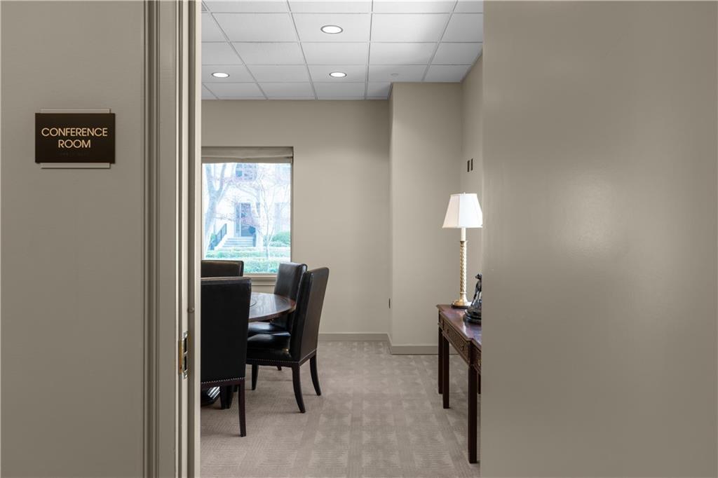 3475 Oak Valley Road Northeast, Unit 2820 Atlanta, GA 30326 - Photo 69 of 86 a view of a workspace with furniture and a window