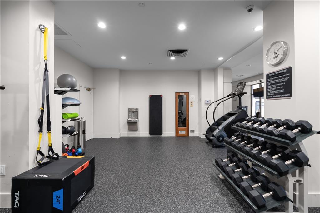 3475 Oak Valley Road Northeast, Unit 2820 Atlanta, GA 30326 - Photo 76 of 86 a kitchen with stainless steel appliances granite countertop a stove and a refrigerator