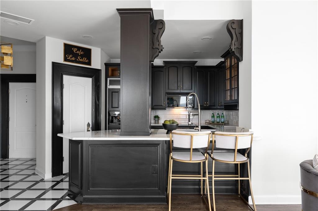 3475 Oak Valley Road Northeast, Unit 2820 Atlanta, GA 30326 - Photo 8 of 86 a kitchen with a sink cabinets and window