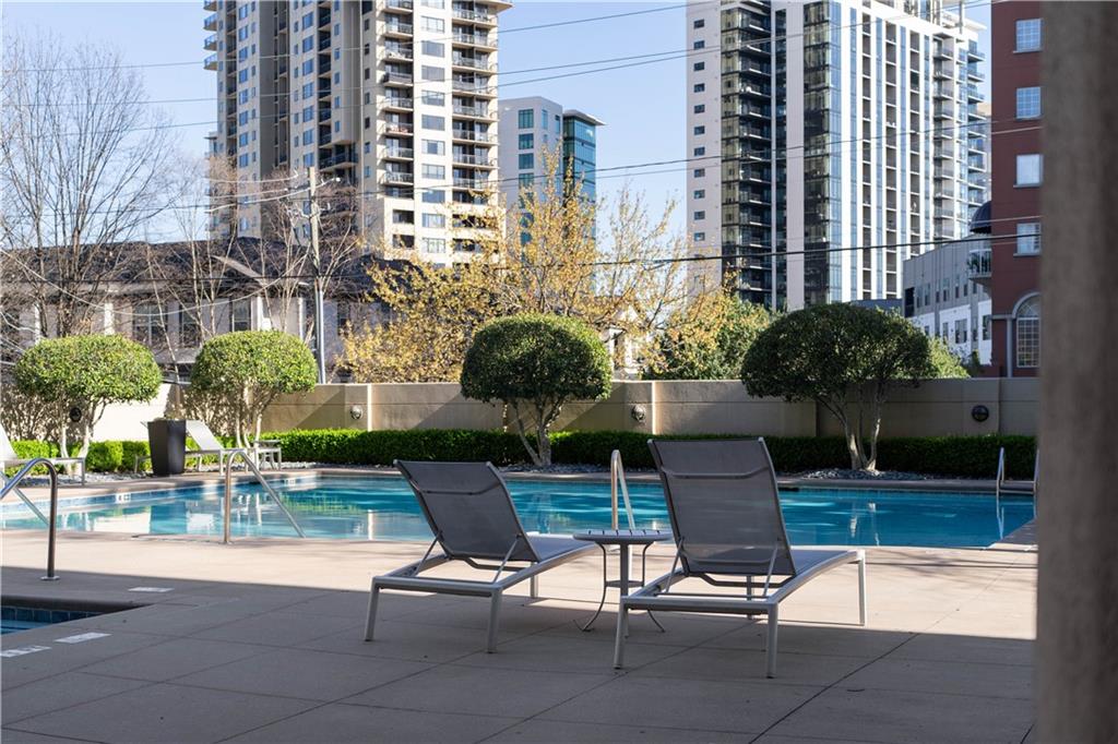 3475 Oak Valley Road Northeast, Unit 2820 Atlanta, GA 30326 - Photo 86 of 86 a view of two chairs and tables in the patio