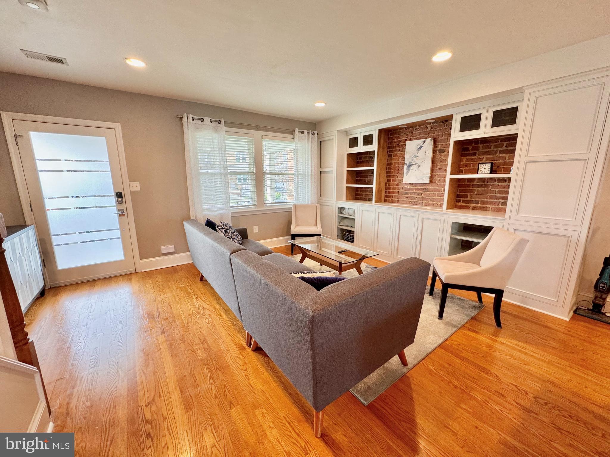 1334 Queen Street Northeast Washington, DC 20002 - Photo 5 of 37 Custom built-in has retractable TV screen!