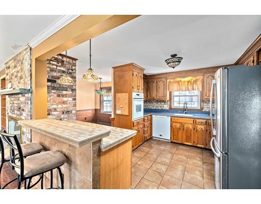 107 Oak Street Middleboro, MA 02346 - Photo 4 of 24 a large kitchen with a table and chairs