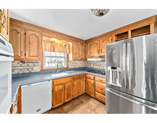 107 Oak Street Middleboro, MA 02346 - Photo 5 of 24 a kitchen with stainless steel appliances granite countertop a refrigerator and a sink