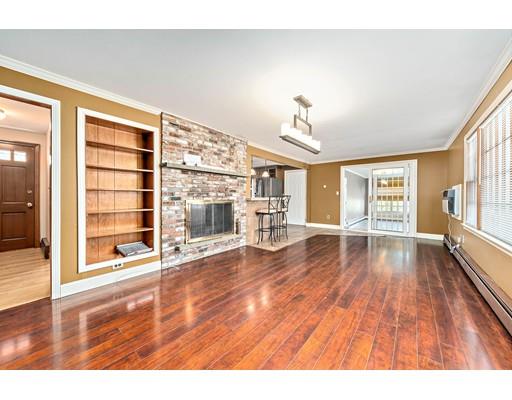 107 Oak Street Middleboro, MA 02346 - Photo 7 of 24 a view of an empty room with wooden floor and a window