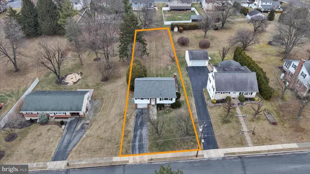 an aerial view of a house with outdoor space
